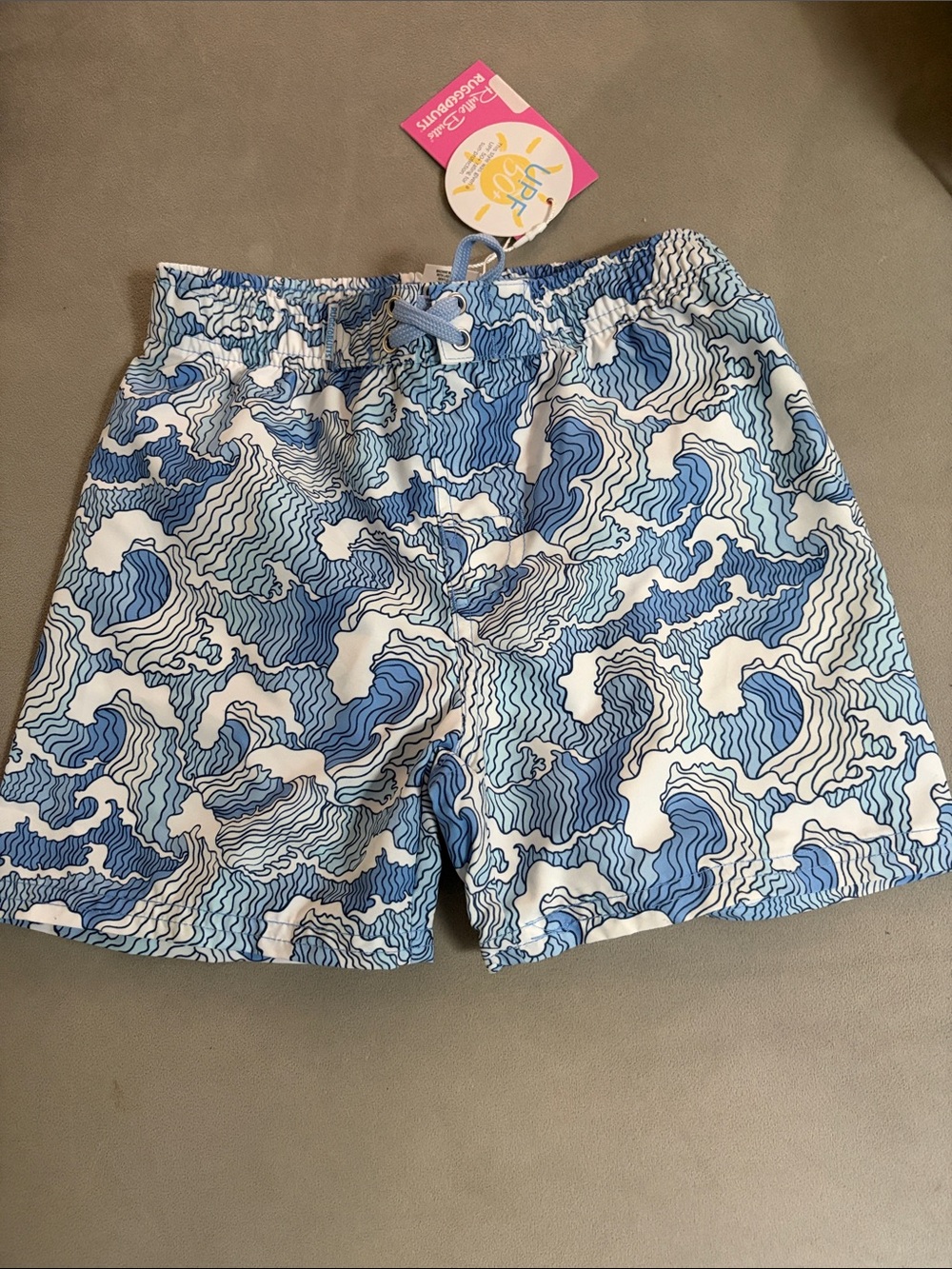 Rugged Butts Blue & White Wave Swim trunks.